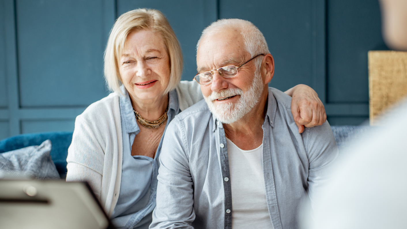 Senior couple reviewing care options
